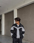 the Suspended Clothing reflective parachute summer jacket showing the oversized streetwear fit.