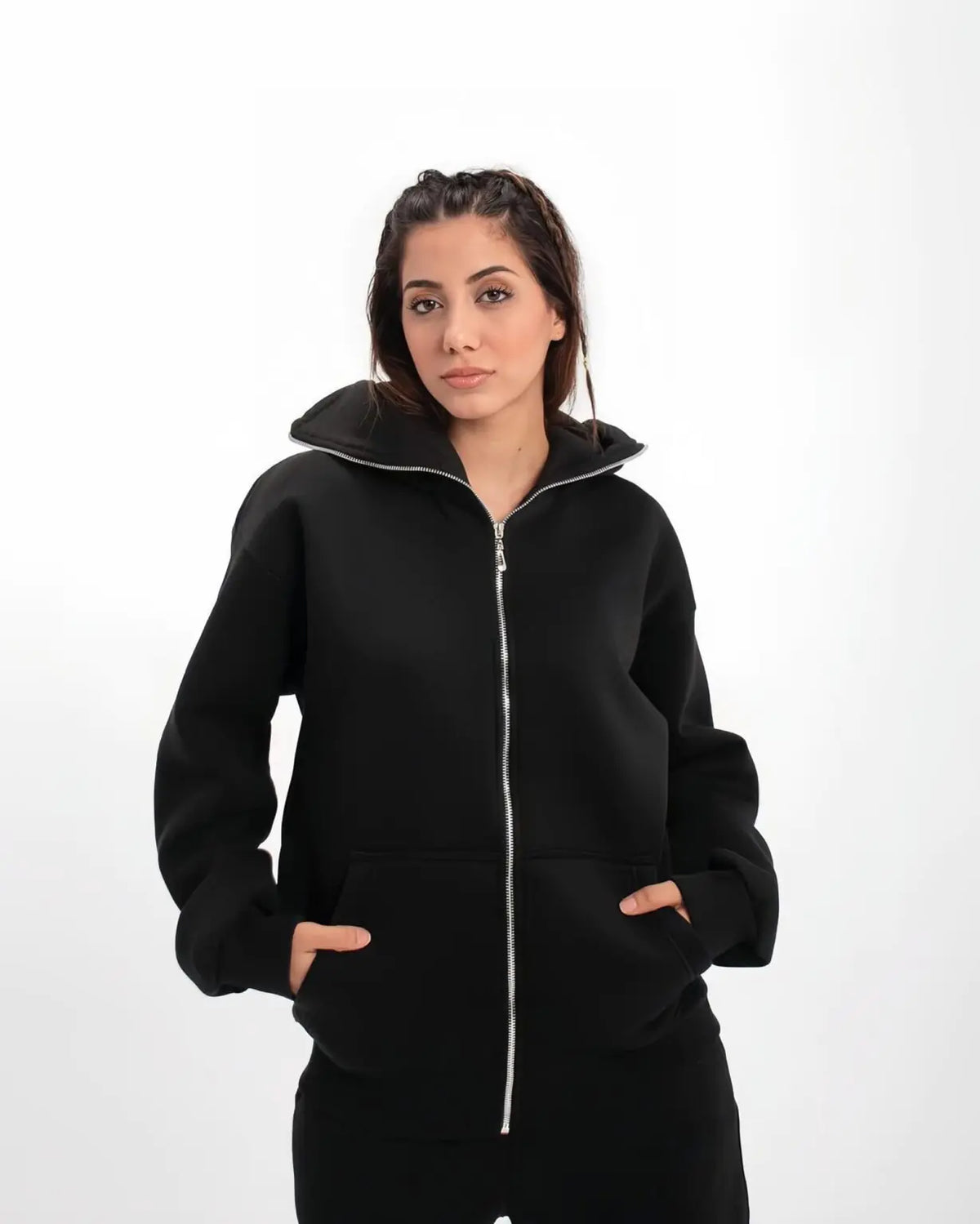 Model wearing Suspended Clothing achromatic black balaclava hoodie demonstrating anatomical stealth for cyber-goth techwear aesthetic.